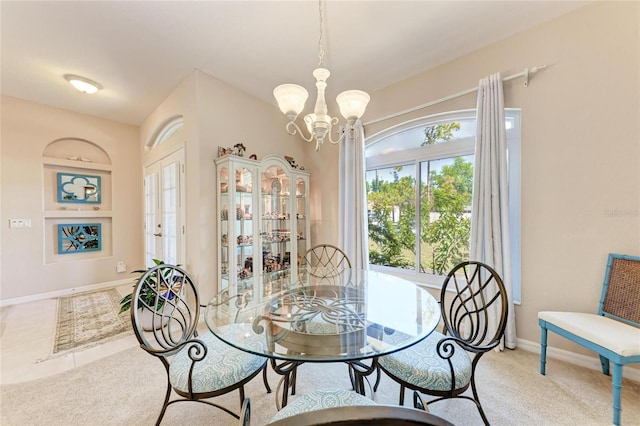 1631 Madison Ave, North Port, FL 34286 - carpeted dining room with baseboards and a notable chandelier