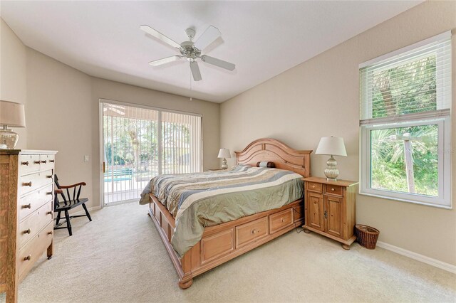 1631 Madison Ave, North Port, FL 34286 - bedroom with multiple windows, baseboards, access to outside, and light carpet