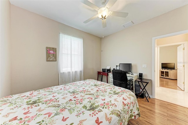 1631 Madison Ave, North Port, FL 34286 - bedroom featuring wood finished floors, a ceiling fan, and visible vents