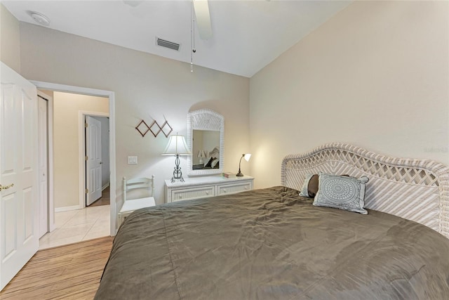 1631 Madison Ave, North Port, FL 34286 - bedroom with visible vents, light tile patterned flooring, and vaulted ceiling