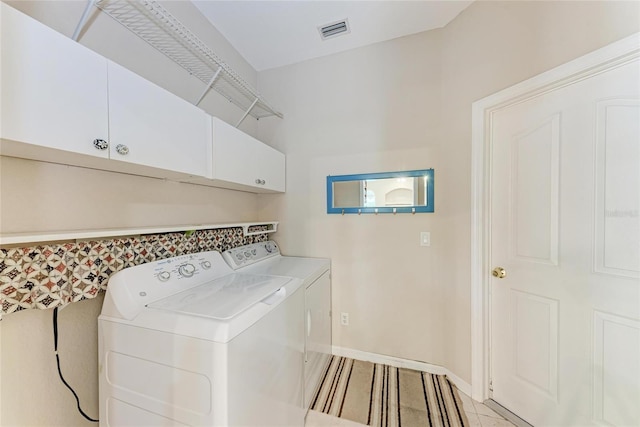 1631 Madison Ave, North Port, FL 34286 - washroom featuring cabinet space, visible vents, independent washer and dryer, and baseboards