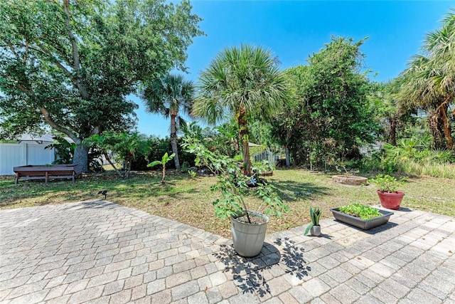1631 Madison Ave, North Port, FL 34286 - view of patio featuring fence and a fire pit