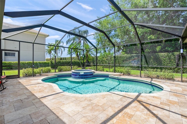 view of swimming pool with a lanai, a pool with connected hot tub, and a patio area