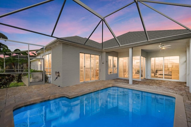 back of house featuring an outdoor pool, roof with shingles, a patio, and stucco siding