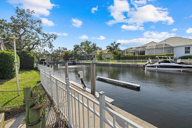 dock area featuring a water view and a residential view