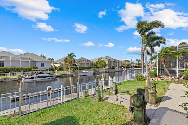 exterior space featuring boat lift, fence, a residential view, and a boat dock