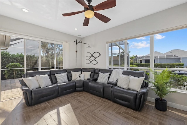 living room with recessed lighting, baseboards, and ceiling fan