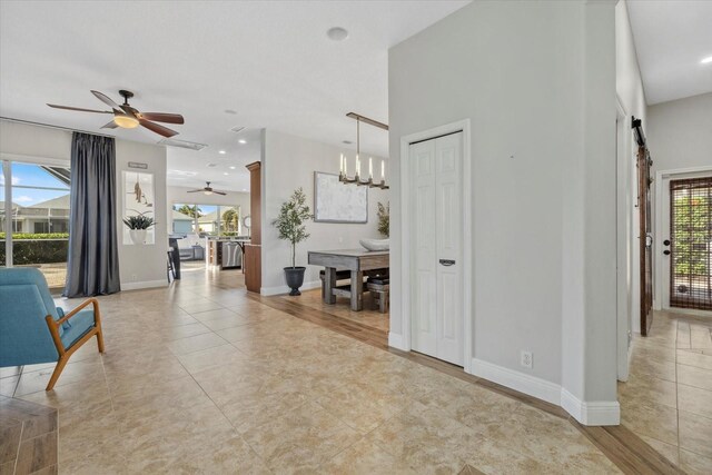 interior space featuring recessed lighting, light tile patterned floors, baseboards, and ceiling fan