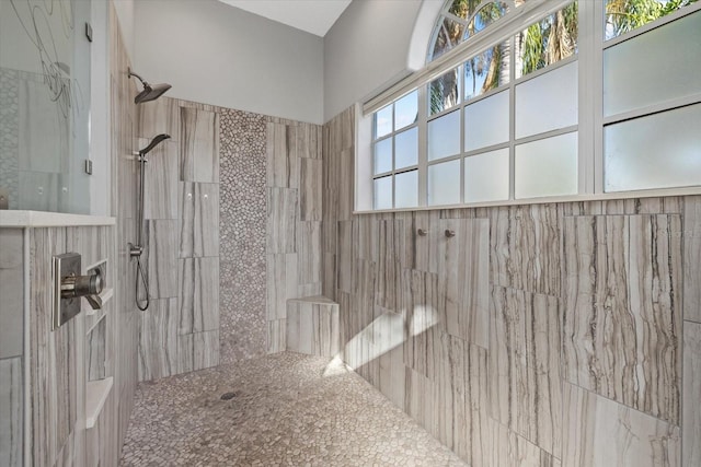 bathroom with a tile shower