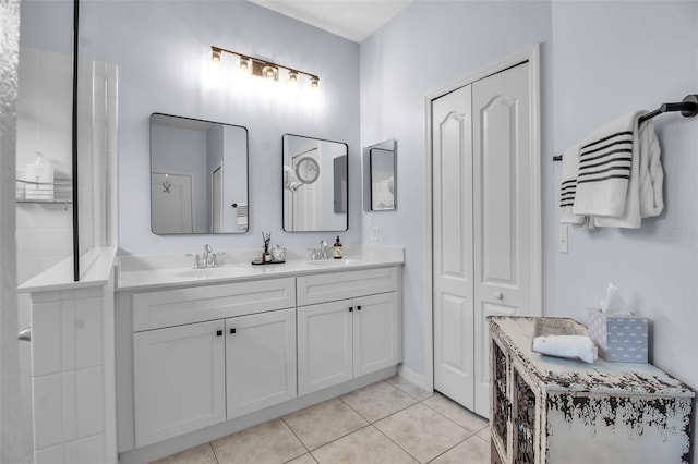 bathroom featuring double vanity and tile patterned flooring