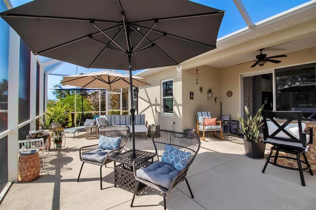 view of patio with an outdoor hangout area, ceiling fan, and a lanai