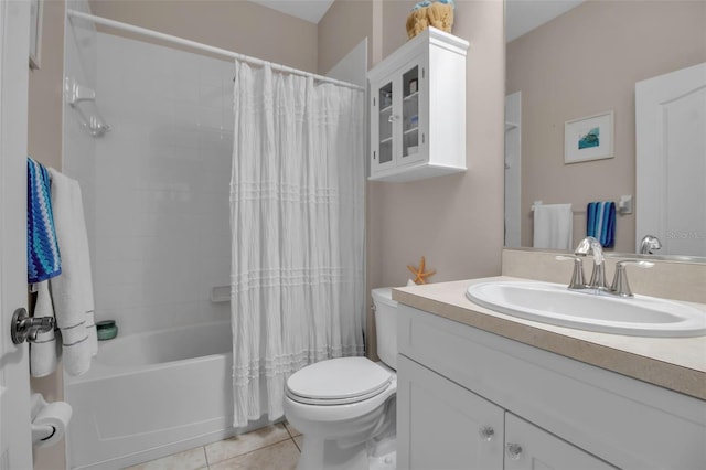 bathroom with tile patterned floors, toilet, vanity, and shower / bath combination with curtain