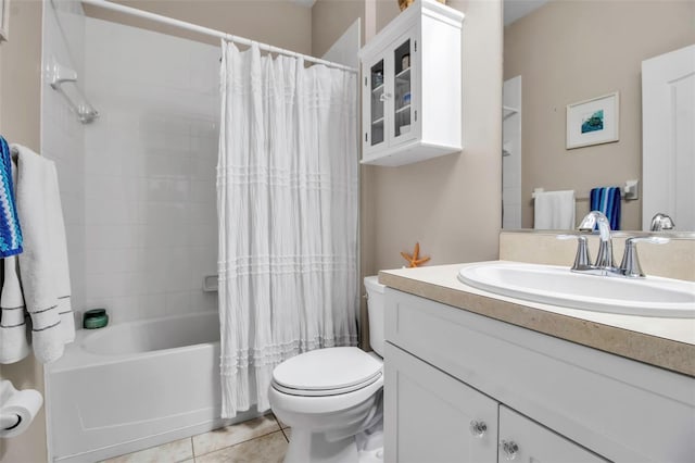 full bath featuring toilet, tile patterned flooring, vanity, and shower / bath combo with shower curtain