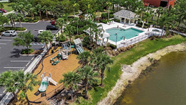aerial view of a pool and a large body of water