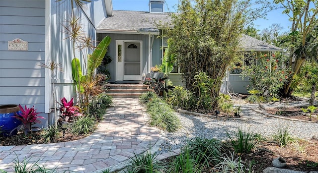 5324 Siesta Ct, Sarasota, FL 34242 - property entrance with roof with shingles