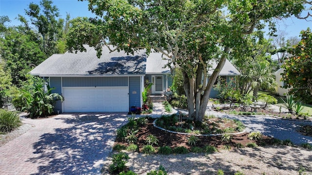 5324 Siesta Ct, Sarasota, FL 34242 - view of front of property with decorative driveway and an attached garage