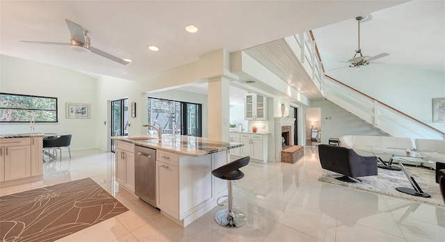 5324 Siesta Ct, Sarasota, FL 34242 - kitchen with a fireplace, open floor plan, a sink, and a ceiling fan