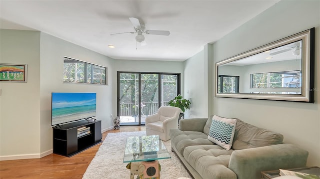 5324 Siesta Ct, Sarasota, FL 34242 - living area featuring a healthy amount of sunlight, baseboards, a ceiling fan, and wood finished floors