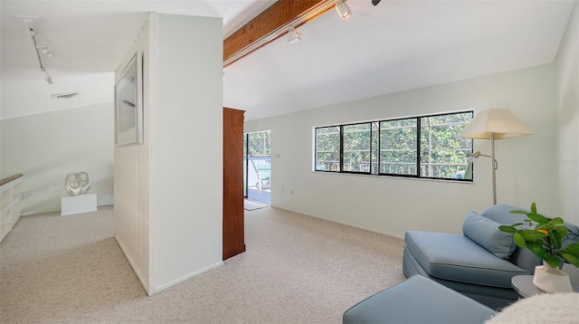 5324 Siesta Ct, Sarasota, FL 34242 - living room with light colored carpet, baseboards, rail lighting, and visible vents