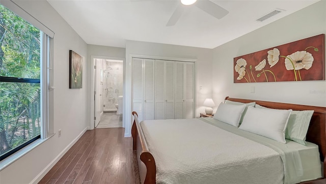 5324 Siesta Ct, Sarasota, FL 34242 - bedroom with dark wood-style flooring, visible vents, multiple windows, and a closet