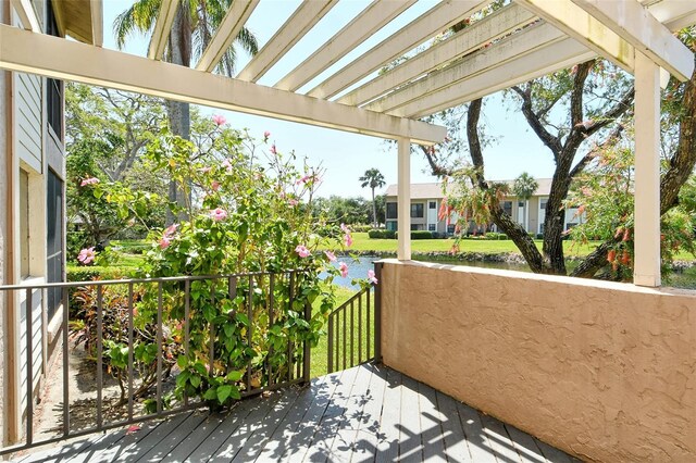 balcony featuring a water view