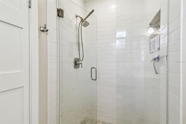 full bath with a shower stall