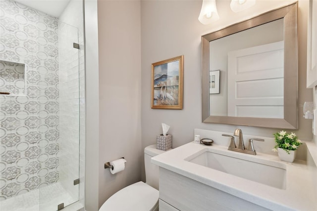 full bath featuring a shower stall, toilet, and vanity