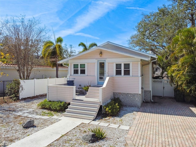view of front of property featuring a gate and fence