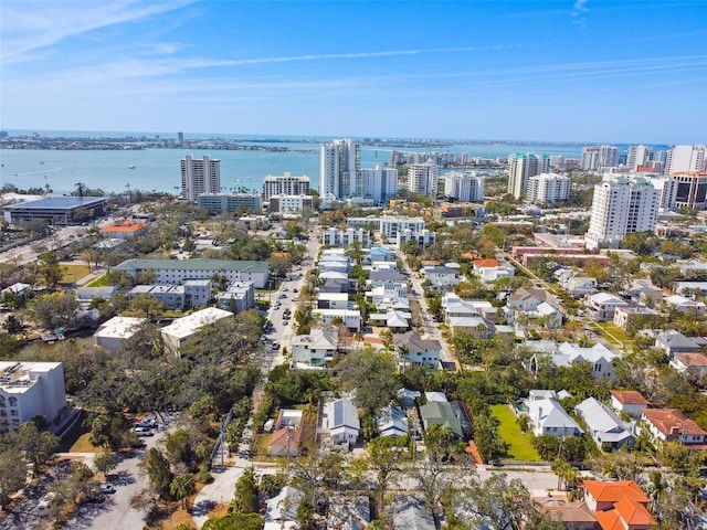 drone / aerial view with a city view and a water view