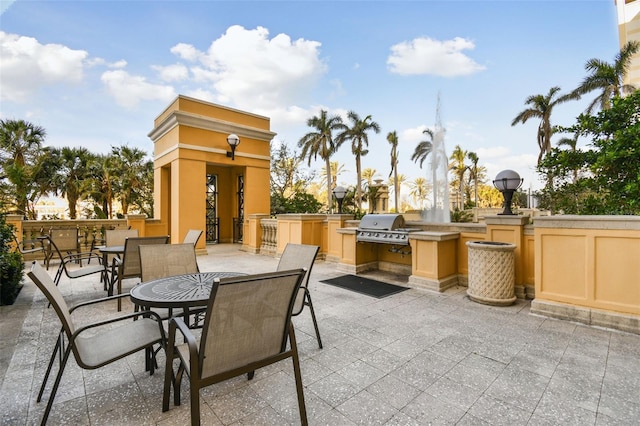 view of patio / terrace with grilling area, outdoor dining space, and area for grilling