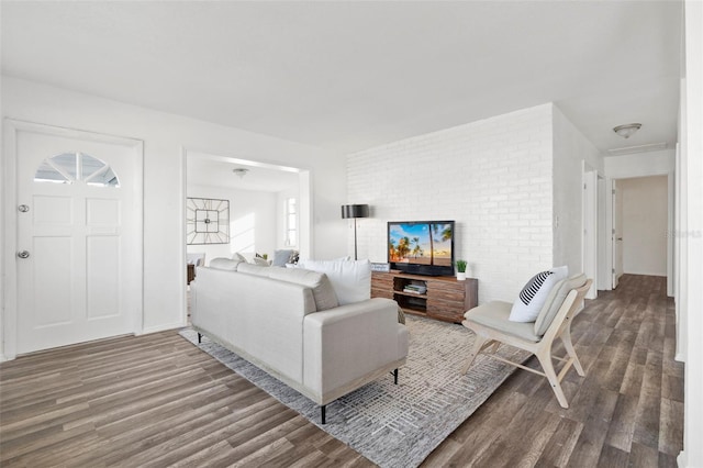 221 Duxbury Ave, Port Charlotte, FL 33952 - living room featuring brick wall and wood finished floors