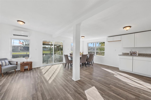 221 Duxbury Ave, Port Charlotte, FL 33952 - dining area featuring baseboards, dark wood-style floors, and a wall unit AC