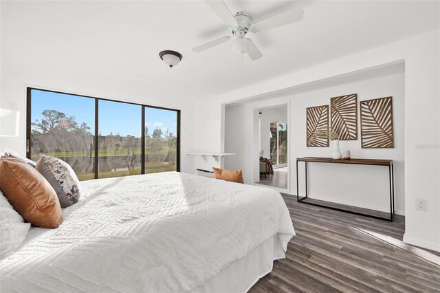 221 Duxbury Ave, Port Charlotte, FL 33952 - bedroom with access to outside, a ceiling fan, baseboards, and wood finished floors