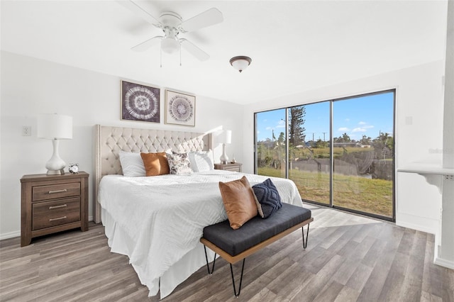 221 Duxbury Ave, Port Charlotte, FL 33952 - bedroom featuring access to outside, a ceiling fan, light wood finished floors, and baseboards