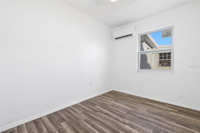 221 Duxbury Ave, Port Charlotte, FL 33952 - empty room with an AC wall unit, a ceiling fan, baseboards, and wood finished floors
