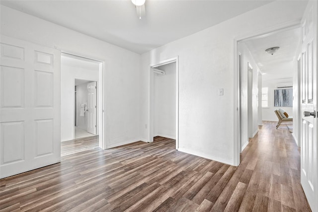 221 Duxbury Ave, Port Charlotte, FL 33952 - unfurnished bedroom with baseboards, wood finished floors, and a closet