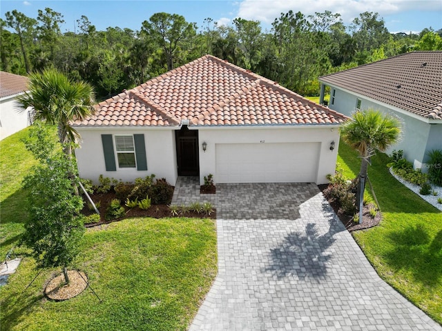 412 Dalily Blvd, Nokomis, FL 34275 - mediterranean / spanish home with stucco siding, a garage, a front yard, decorative driveway, and a tile roof
