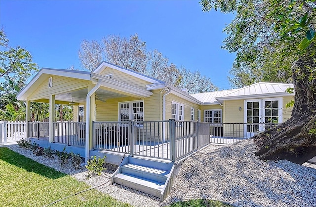 exterior space with a ceiling fan
