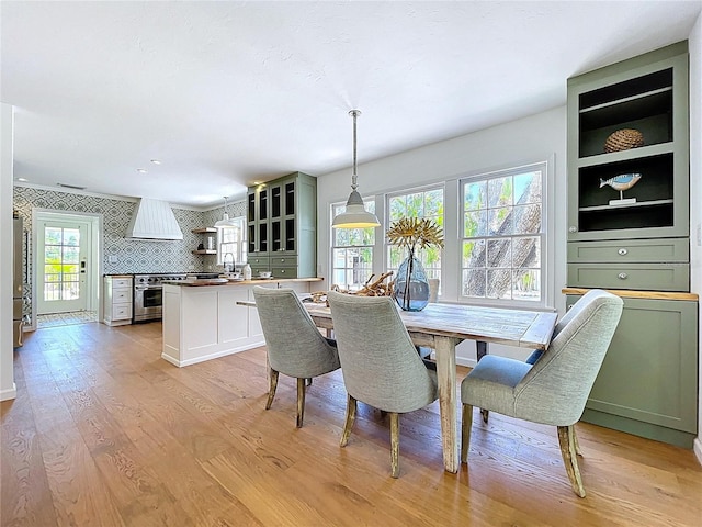 dining area featuring light wood-style floors