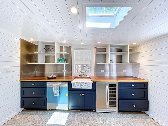 bar with wooden walls, stainless steel dishwasher, beverage cooler, and a sink