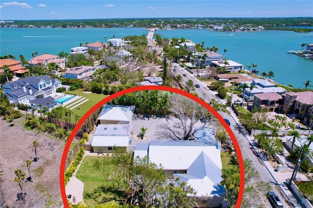 aerial view featuring a water view and a residential view
