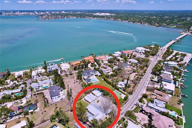 bird's eye view featuring a residential view and a water view