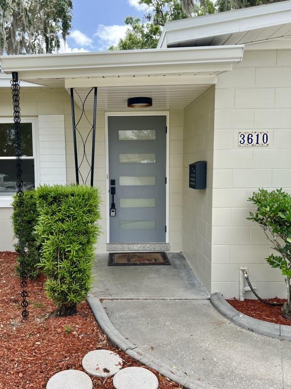 3610 Pershing Ave, Orlando, FL 32812 - entrance to property with concrete block siding