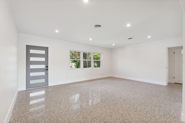 3610 Pershing Ave, Orlando, FL 32812 - spare room with baseboards, speckle patterned floor, and recessed lighting
