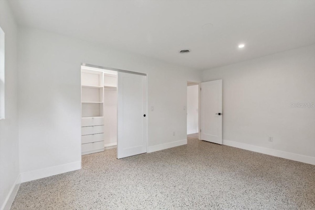 3610 Pershing Ave, Orlando, FL 32812 - unfurnished bedroom with speckled floor, baseboards, a closet, and recessed lighting