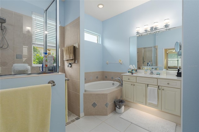 3312 92nd Ave E, Parrish, FL 34219 - bathroom with walk in shower, a bath, vanity, and tile patterned flooring