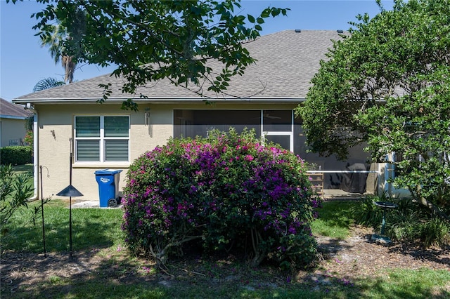 3312 92nd Ave E, Parrish, FL 34219 - view of property exterior featuring stucco siding and roof with shingles