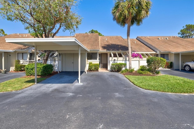 view of front of home featuring a carport