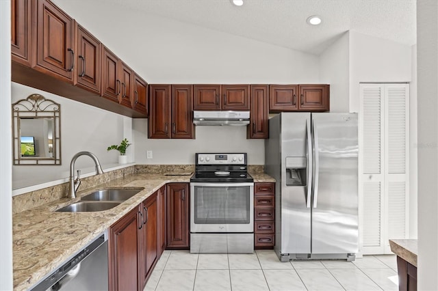 kitchen featuring light tile patterned floors, under cabinet range hood, a sink, lofted ceiling, and stainless steel appliances