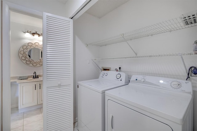 washroom with laundry area, visible vents, marble finish floor, a sink, and washer and dryer